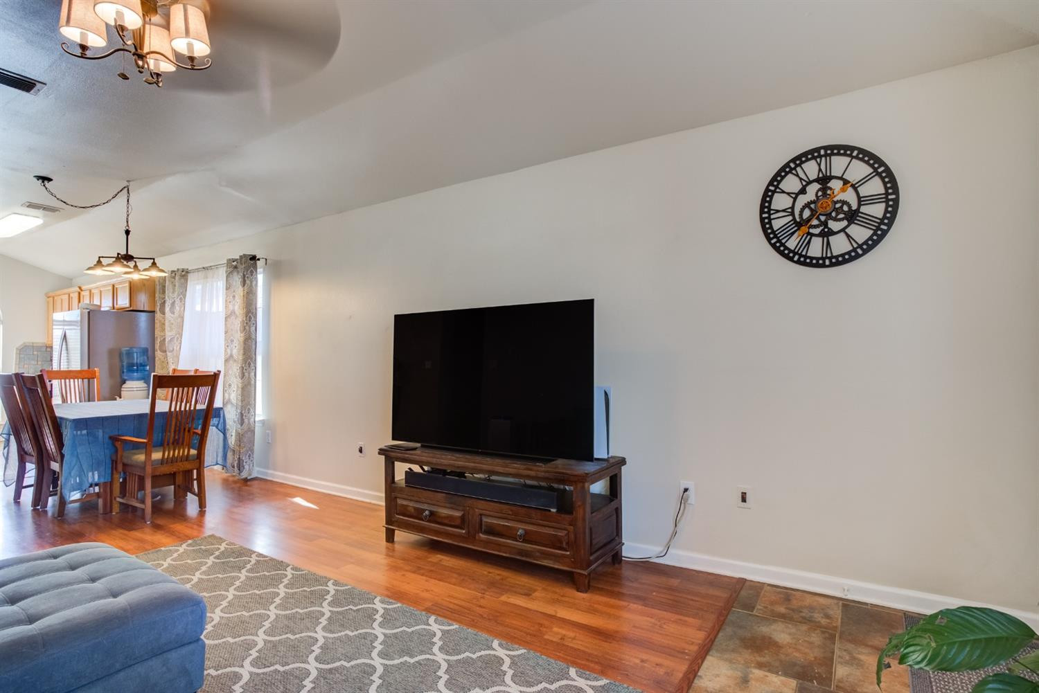 6514 86th Street Lubbock, TX 79424 - Photo 16 of 34 a living room with furniture and a flat screen tv