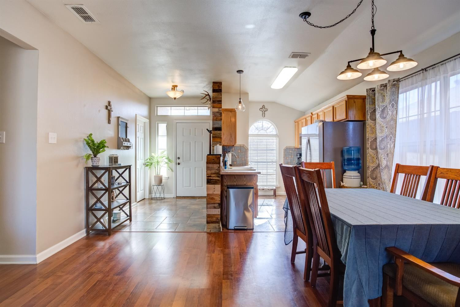 6514 86th Street Lubbock, TX 79424 - Photo 17 of 34 a view of a dining room with furniture and wooden floor