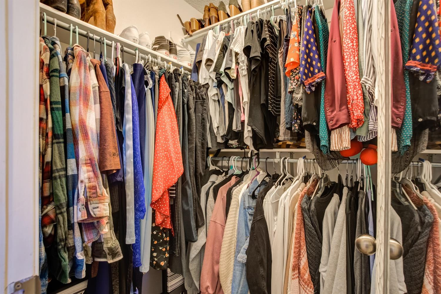 6514 86th Street Lubbock, TX 79424 - Photo 24 of 34 a view of walk in closet with clothes