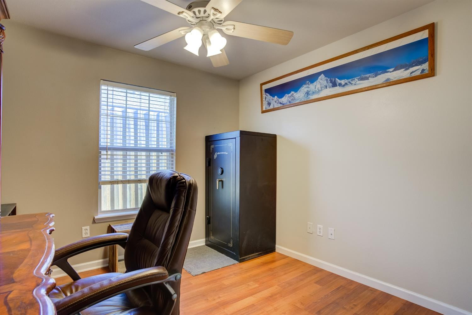 6514 86th Street Lubbock, TX 79424 - Photo 27 of 34 a view of a workspace with furniture and a window