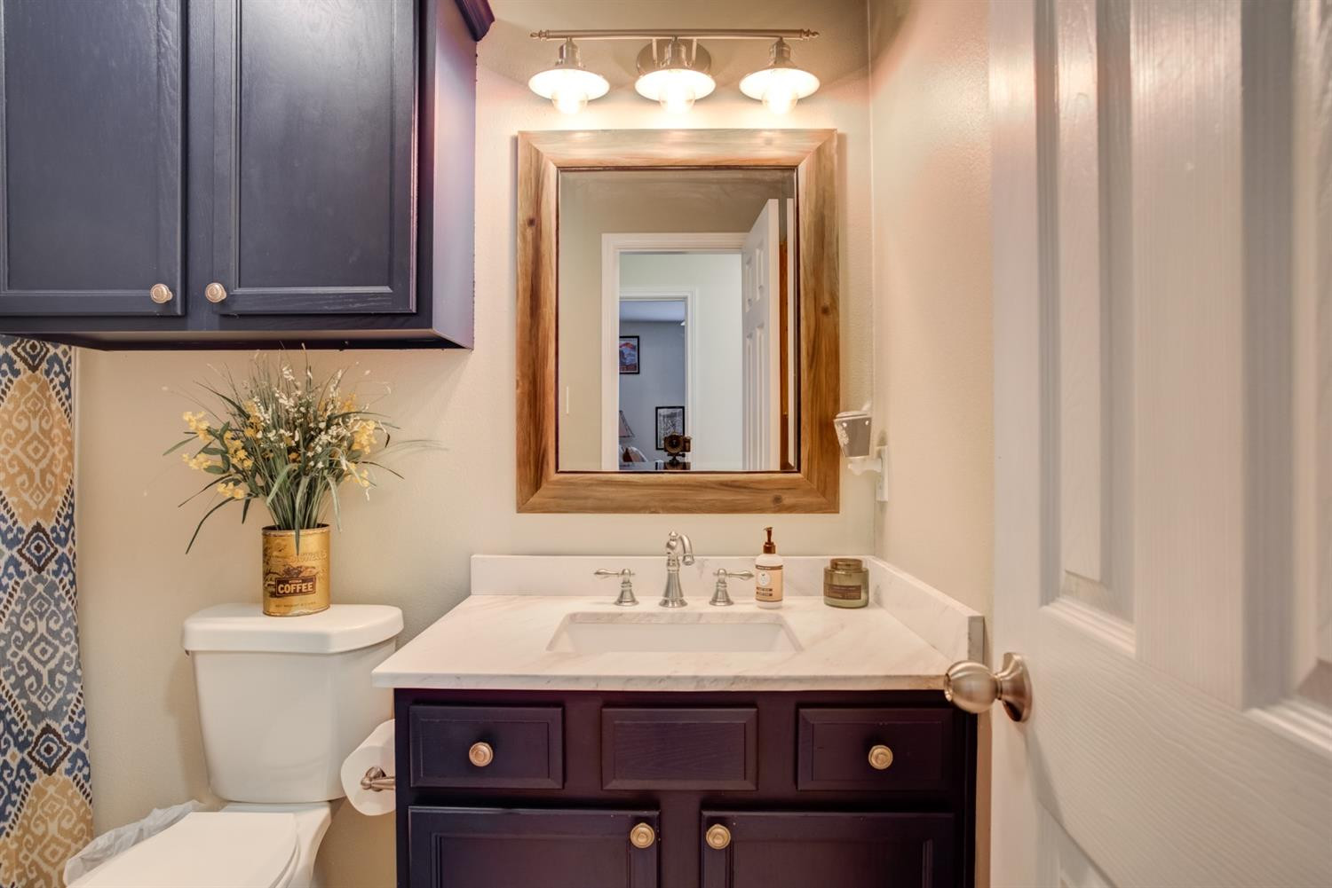 6514 86th Street Lubbock, TX 79424 - Photo 29 of 34 a bathroom with a sink and a mirror