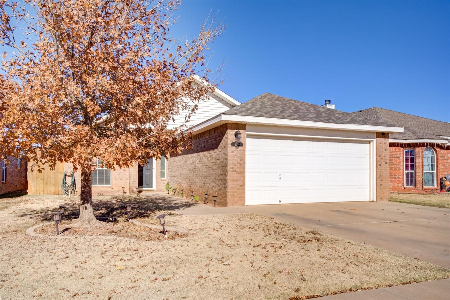 6514 86th Street Lubbock, TX 79424 - Photo 34 of 34 a front view of a house with a yard