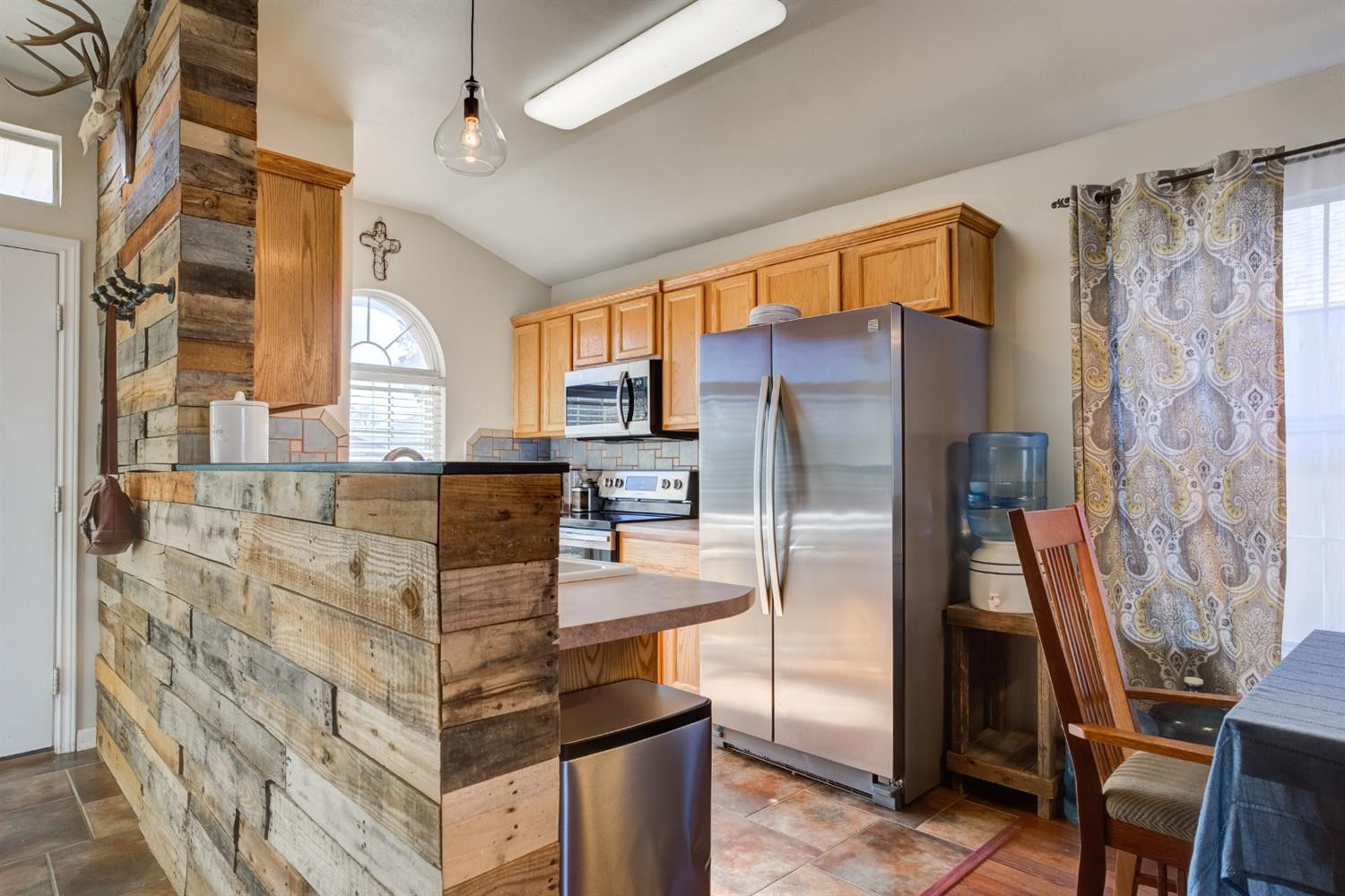 6514 86th Street Lubbock, TX 79424 - Photo 4 of 34 a kitchen with stainless steel appliances granite countertop a refrigerator and a stove