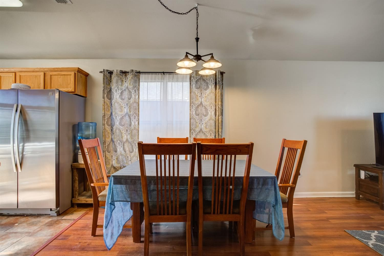 6514 86th Street Lubbock, TX 79424 - Photo 5 of 34 a view of a dining room with furniture window and wooden floor