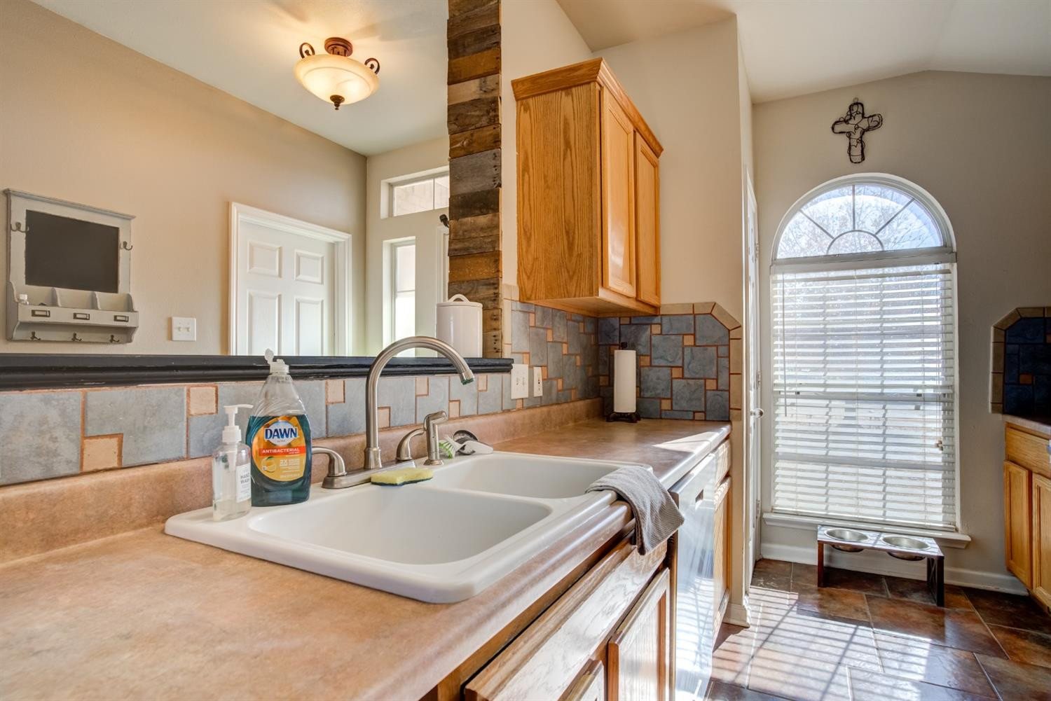 6514 86th Street Lubbock, TX 79424 - Photo 7 of 34 a bathroom with a sink a vanity and a mirror