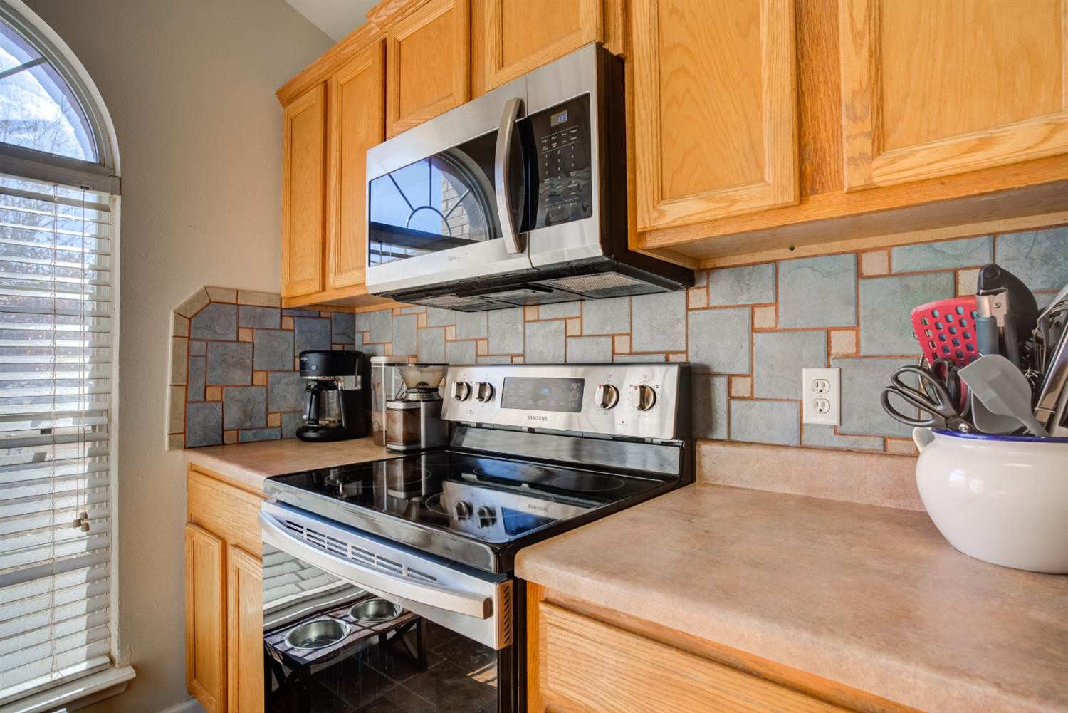 6514 86th Street Lubbock, TX 79424 - Photo 8 of 34 a kitchen with stainless steel appliances granite countertop a sink and cabinets