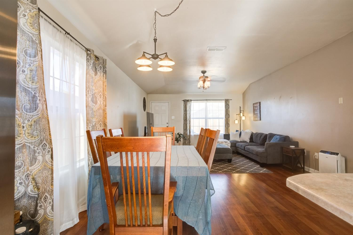 6514 86th Street Lubbock, TX 79424 - Photo 10 of 34 a view of a livingroom with furniture window and wooden floor