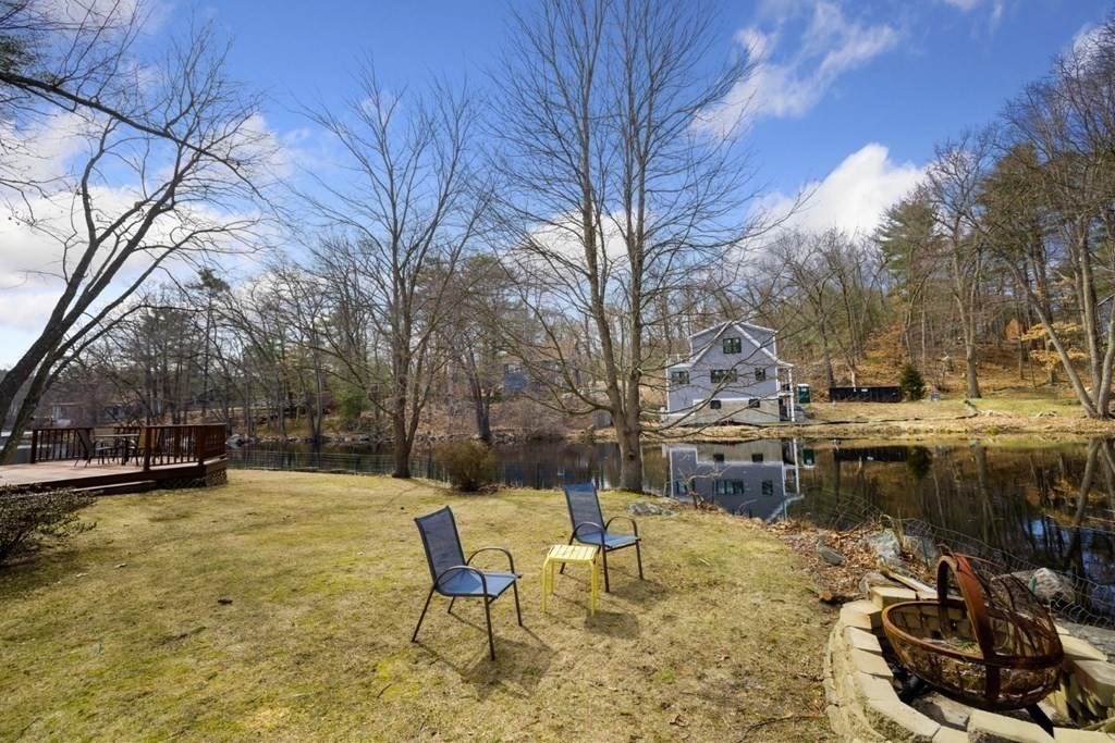 1 Mill Street Middleton, MA 01949 - Photo 14 of 30 a backyard of a house with table and chairs