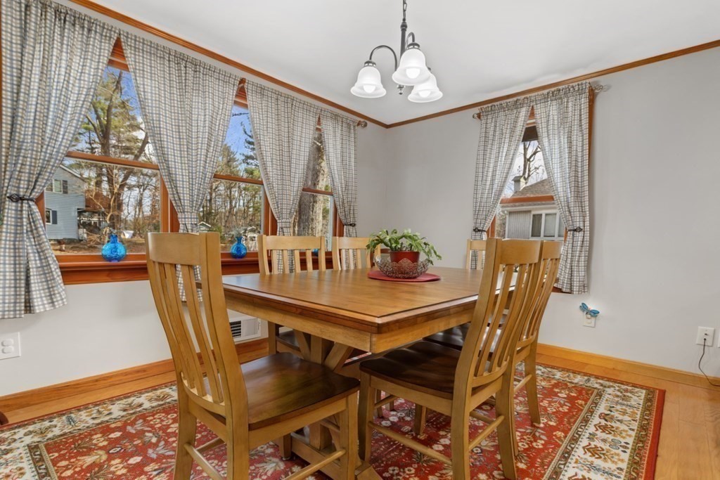 1 Mill Street Middleton, MA 01949 - Photo 16 of 30 a view of a dining room with furniture and chandelier