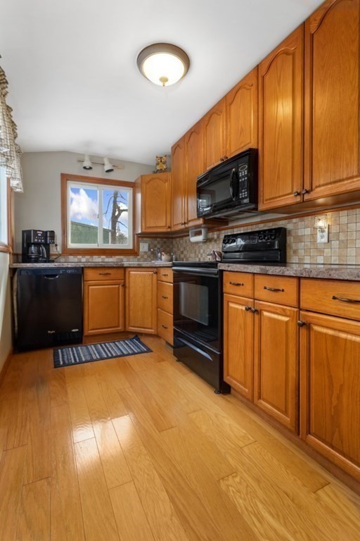 1 Mill Street Middleton, MA 01949 - Photo 17 of 30 a kitchen with stainless steel appliances granite countertop a stove a sink and a microwave