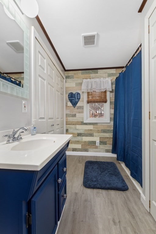 1 Mill Street Middleton, MA 01949 - Photo 24 of 30 a bathroom with a sink and a mirror