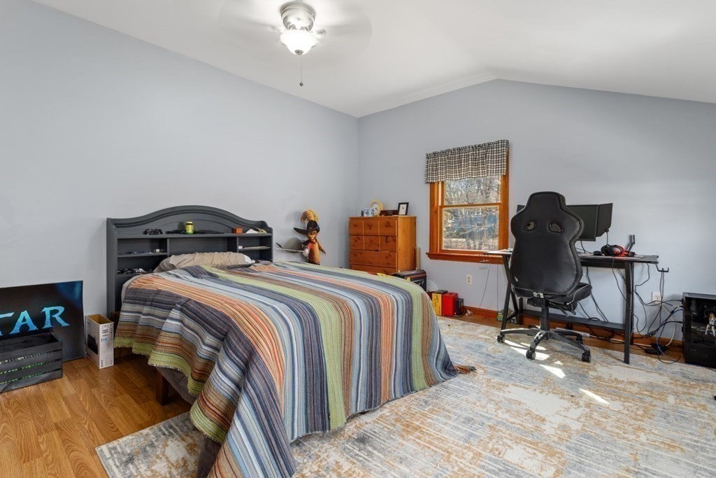 1 Mill Street Middleton, MA 01949 - Photo 27 of 30 a bedroom with a bed and a chair