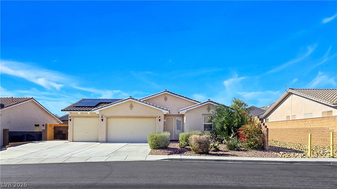 2485 Morrow Ridge Place Laughlin, NV 89029 - Photo 2 of 40 A well-maintained stucco home with an inviting desert-friendly landscape.