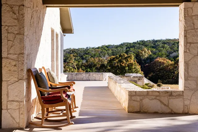 a view of balcony with furniture