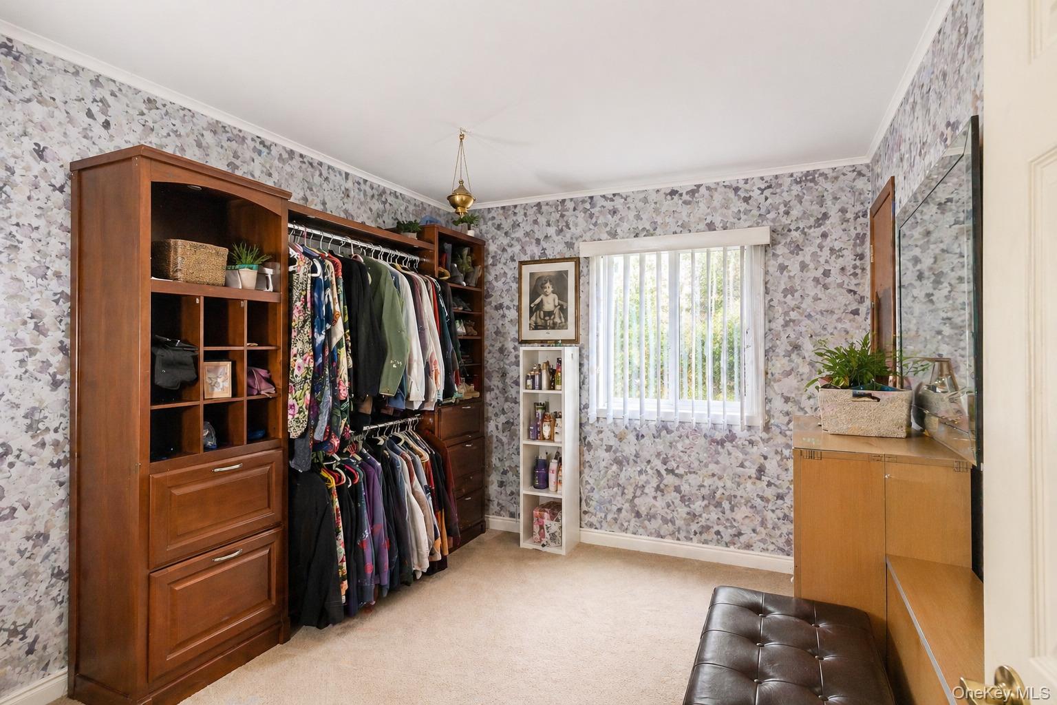 11 Seaford Road Mastic Beach, NY 11951 - Photo 11 of 19 a view of walk in closet with clothes and shoes