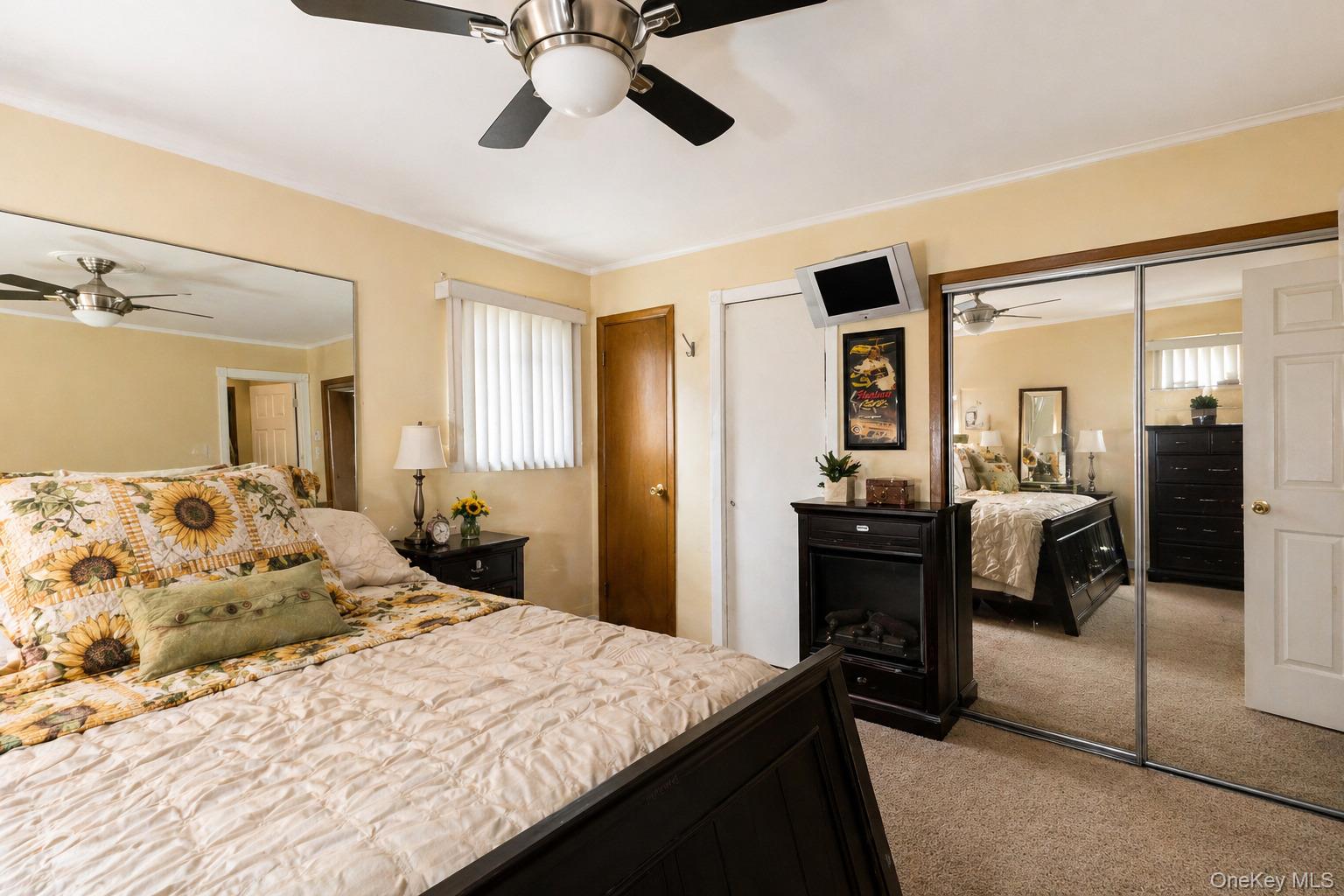 11 Seaford Road Mastic Beach, NY 11951 - Photo 13 of 19 a bedroom with a bed and wooden floor