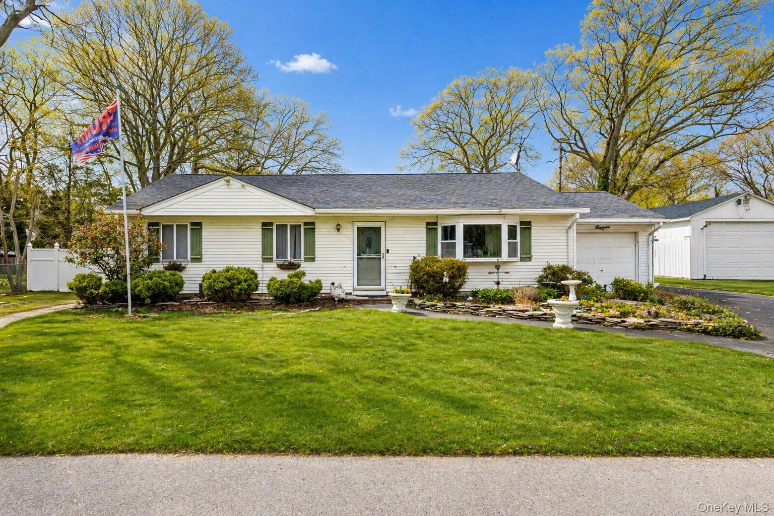 11 Seaford Road Mastic Beach, NY 11951 - Photo 3 of 19 a front view of a house with swimming pool having outdoor seating