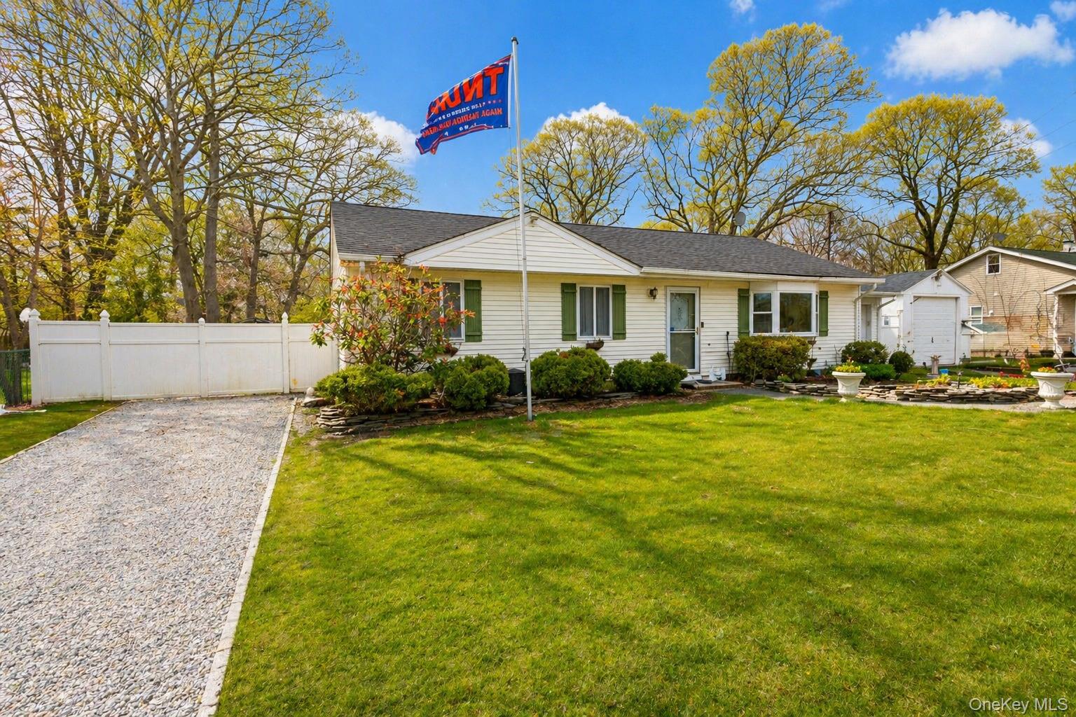 11 Seaford Road Mastic Beach, NY 11951 - Photo 4 of 19 a front view of a house with garden