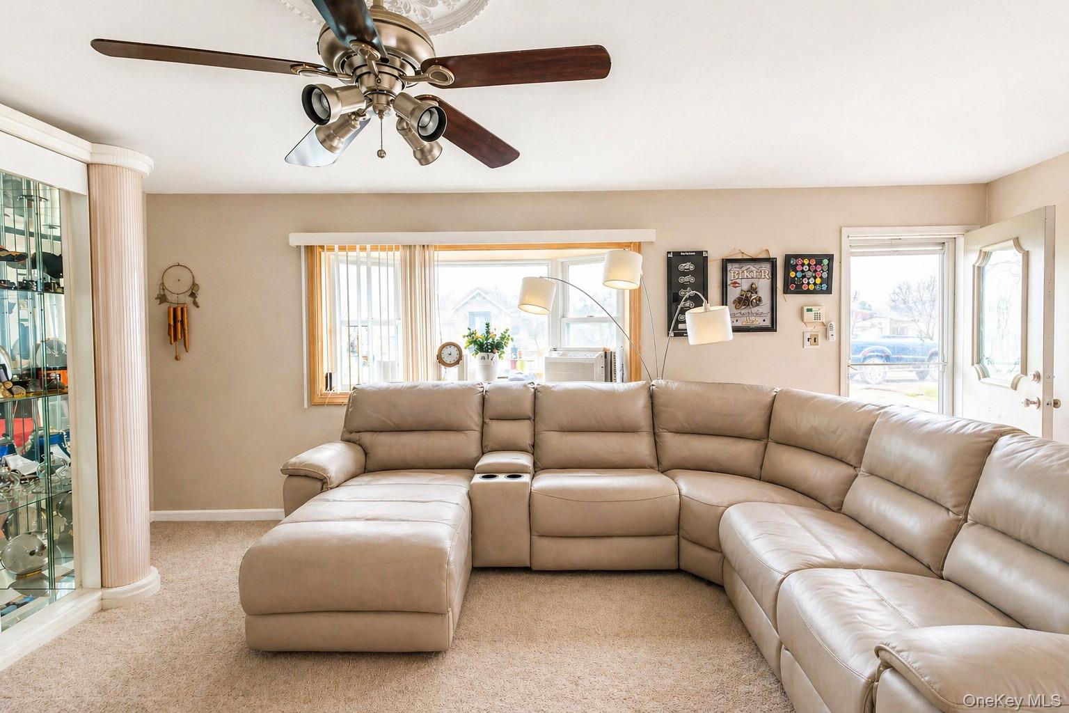 11 Seaford Road Mastic Beach, NY 11951 - Photo 5 of 19 a living room with furniture and a large window