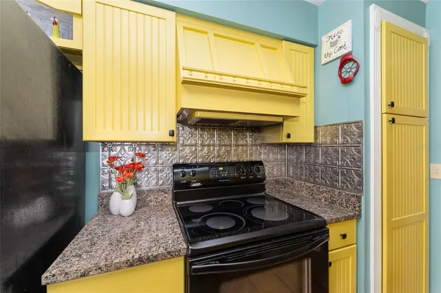 a kitchen with a stove and a sink