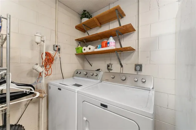 a utility room with dryer and washer