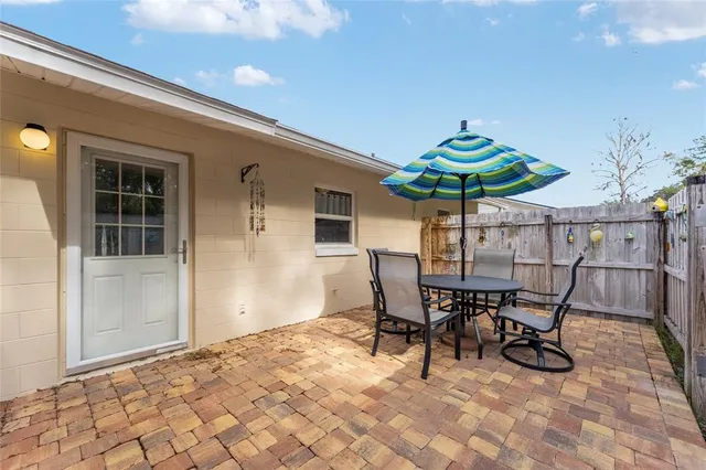 a view of an outdoor dining space with a dining space and furniture