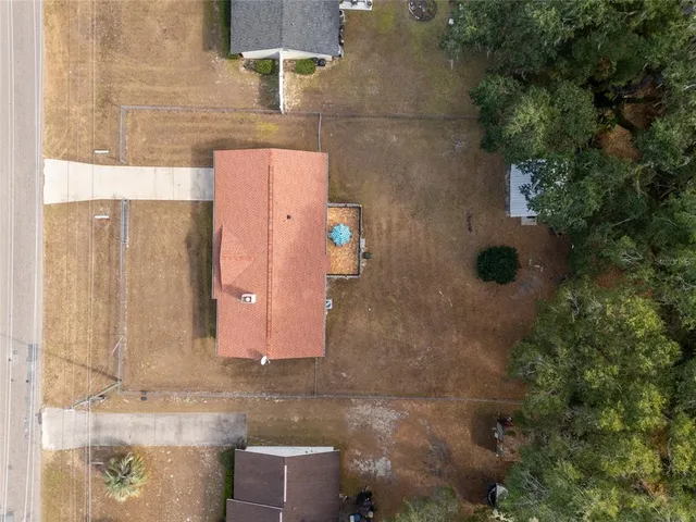 an aerial view of residential house with outdoor space