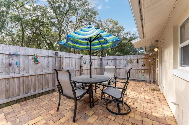 a view of a table and chairs in patio