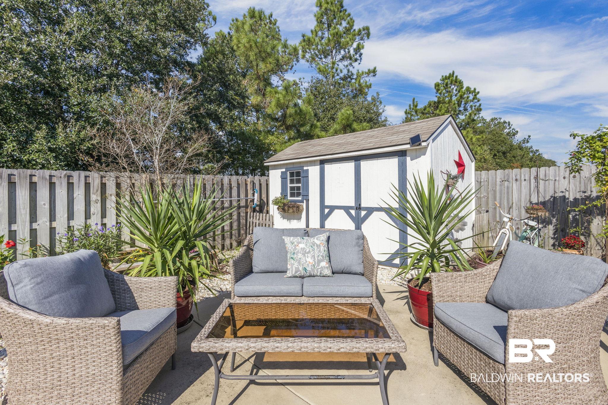 345 Hartenstein Road Foley, AL 36535 - Photo 8 of 47 View of patio featuring a shed