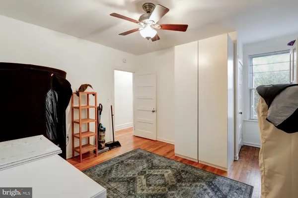 a view of a bedroom with closet and wooden floor