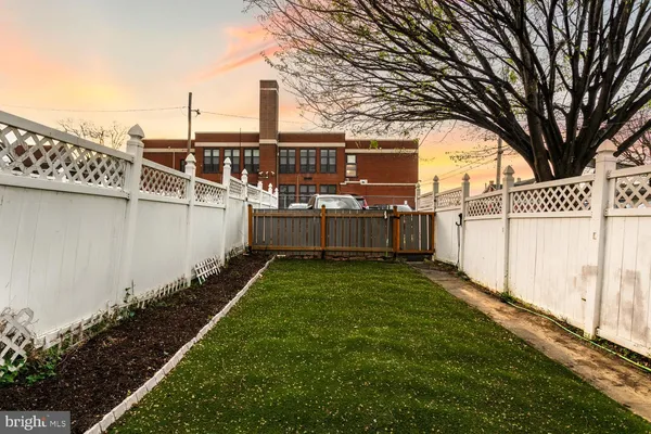 a view of a backyard with sitting area