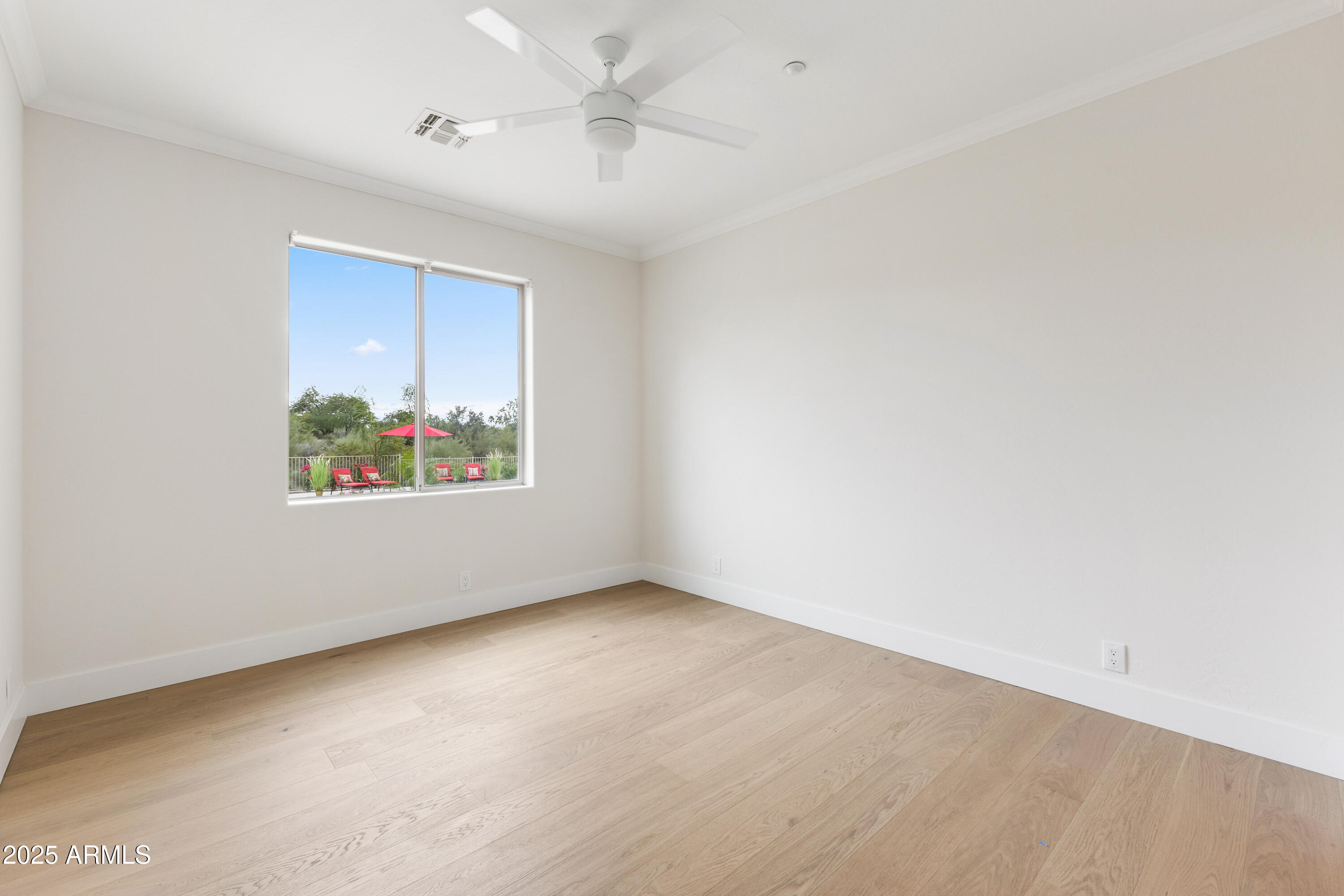 27589 North 61st Place Scottsdale, AZ 85266 - Photo 58 of 89 an empty room with windows and ceiling fan