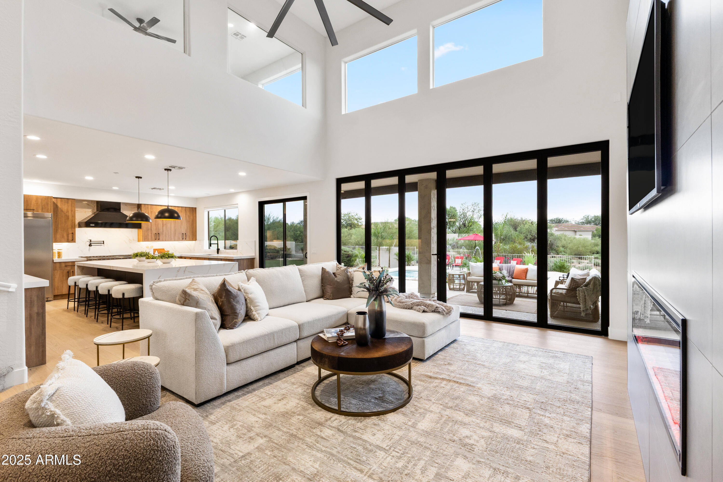 27589 North 61st Place Scottsdale, AZ 85266 - Photo 6 of 89 a living room with furniture and a large window
