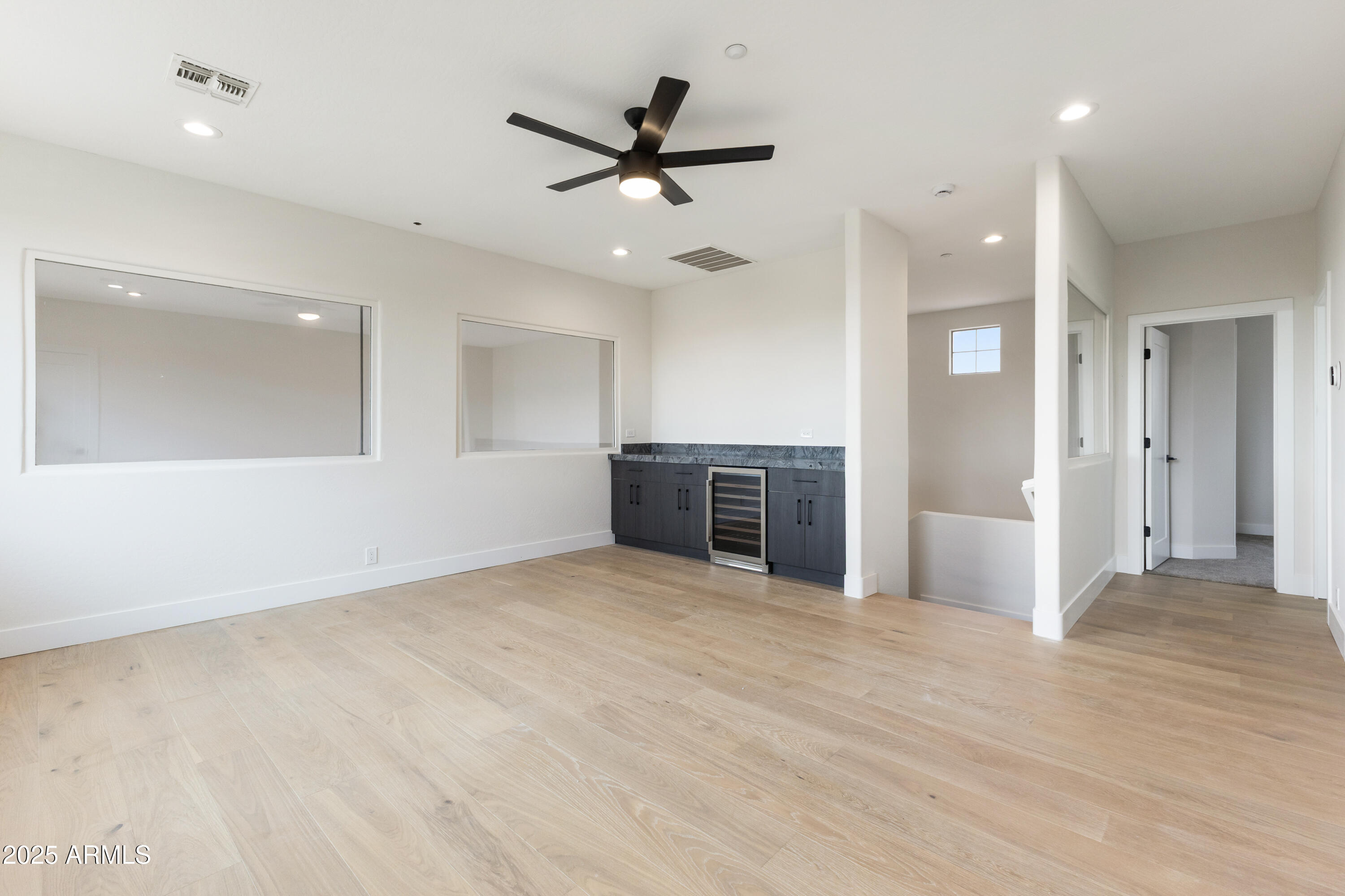 27589 North 61st Place Scottsdale, AZ 85266 - Photo 65 of 89 an empty room with cabinet and stainless steel appliances