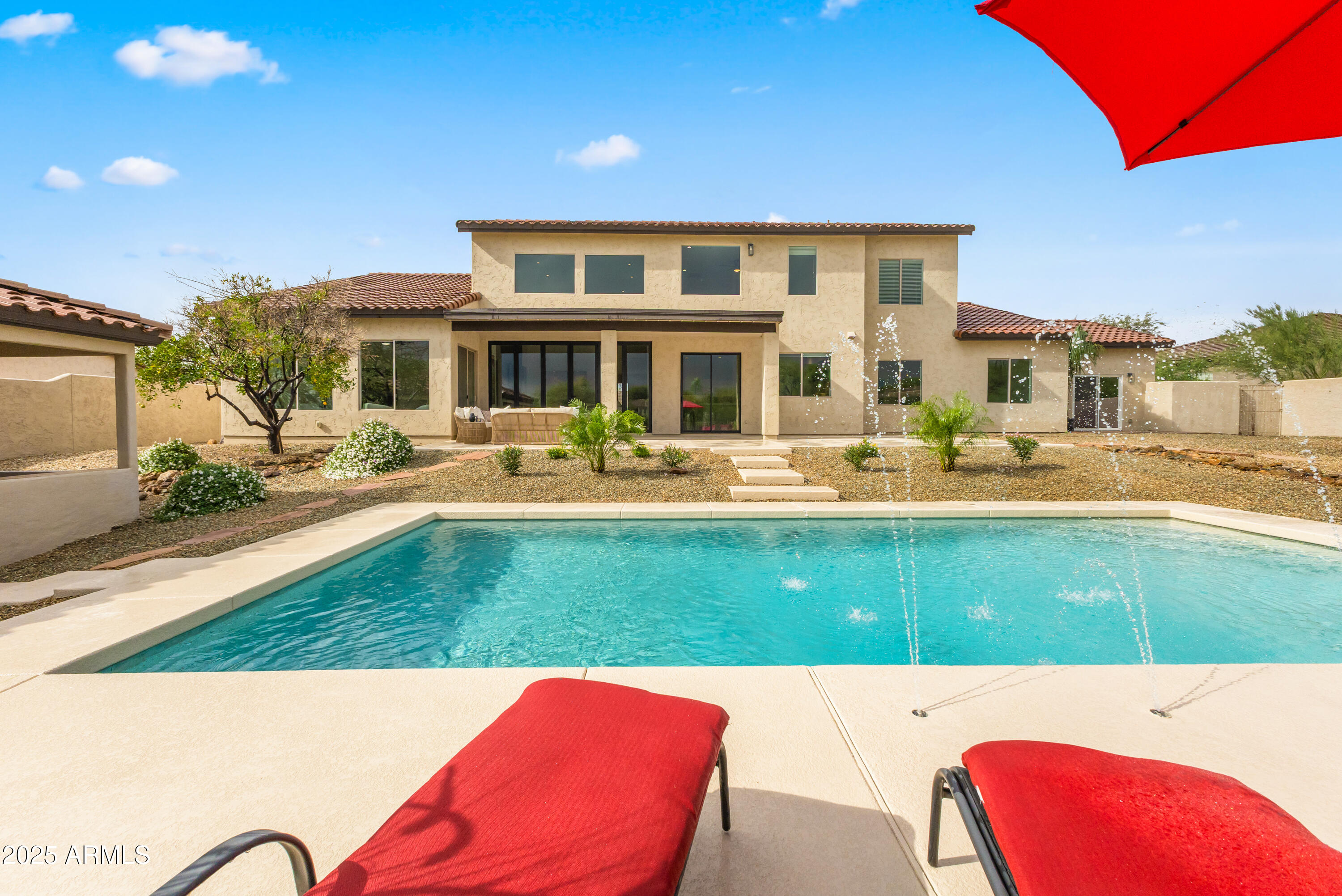 27589 North 61st Place Scottsdale, AZ 85266 - Photo 85 of 89 a balcony with table and chairs