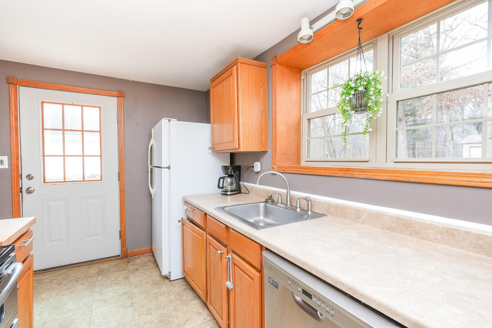 2821 Shadow Road Momence, IL 60954 - Photo 18 of 50 a kitchen with stainless steel appliances granite countertop a sink and a refrigerator