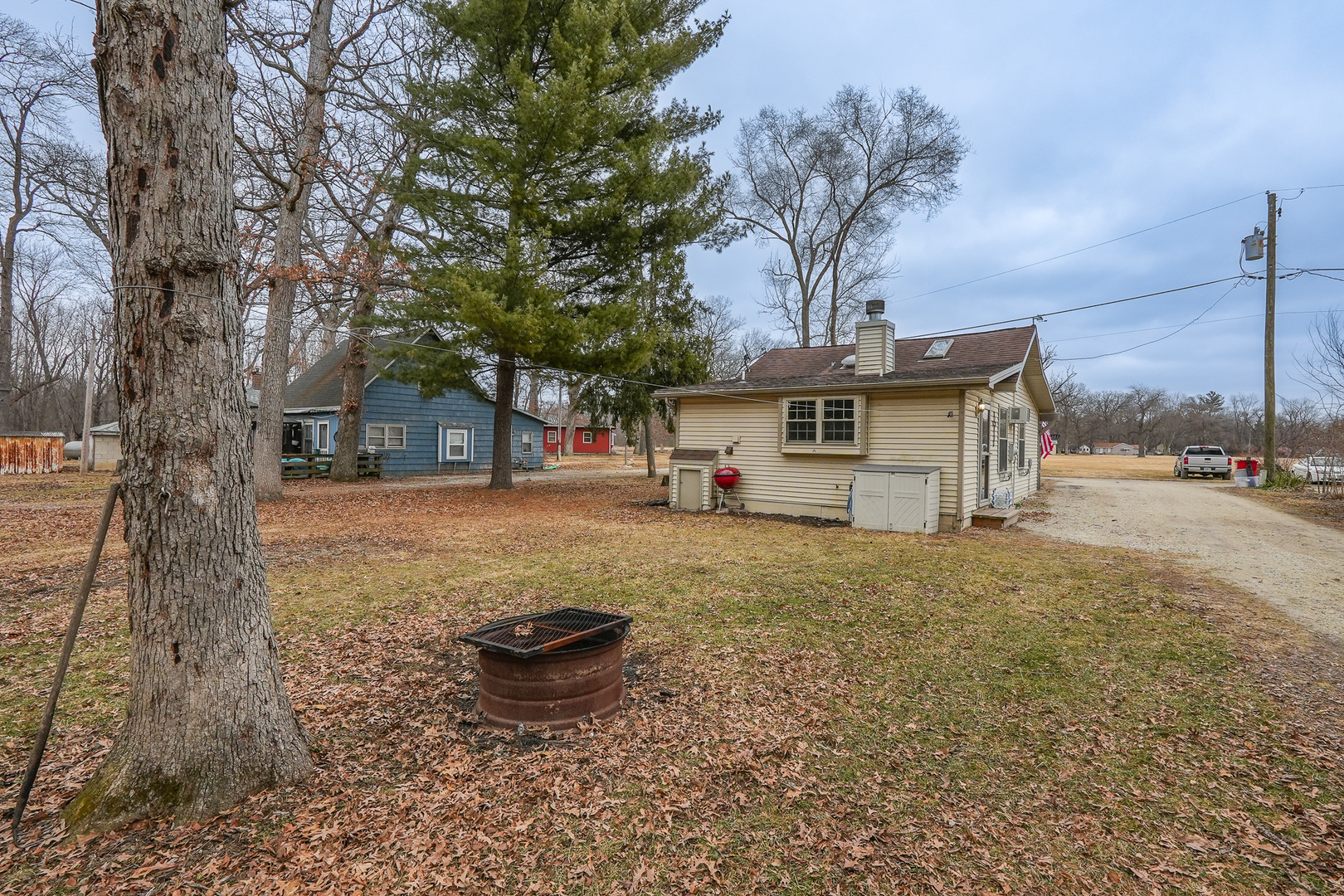 2821 Shadow Road Momence, IL 60954 - Photo 29 of 50 a view of a house with backyard and a tree