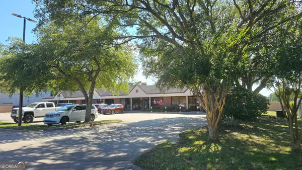 a view of house with outdoor space and swimming pool