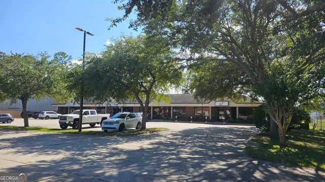 a view of street with parked cars