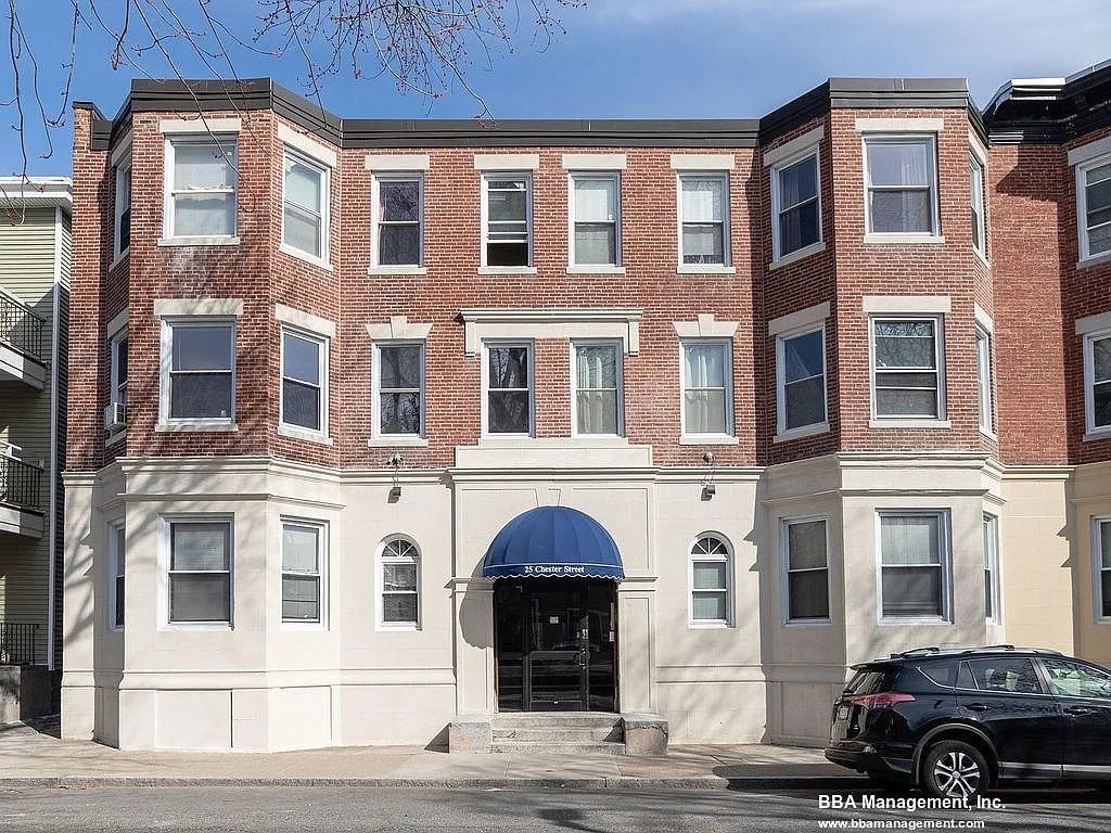 a front view of a building with a lot of windows