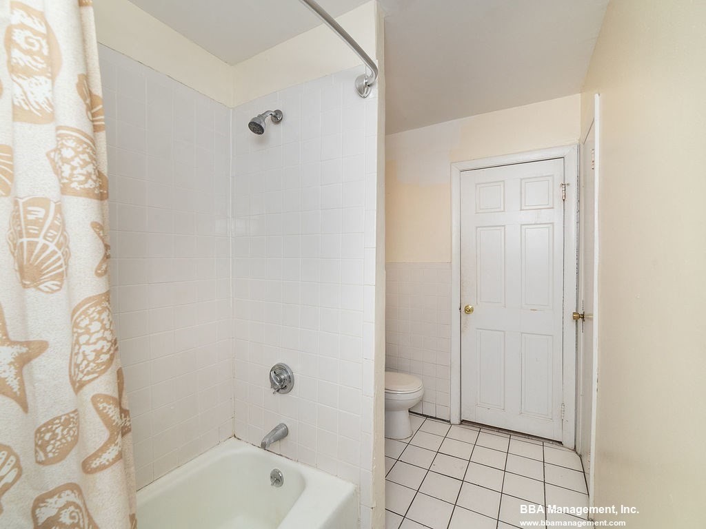 25 Chester Street, Unit 4 Boston, MA 02134 - Photo 7 of 12 a bathroom with a bathtub and shower