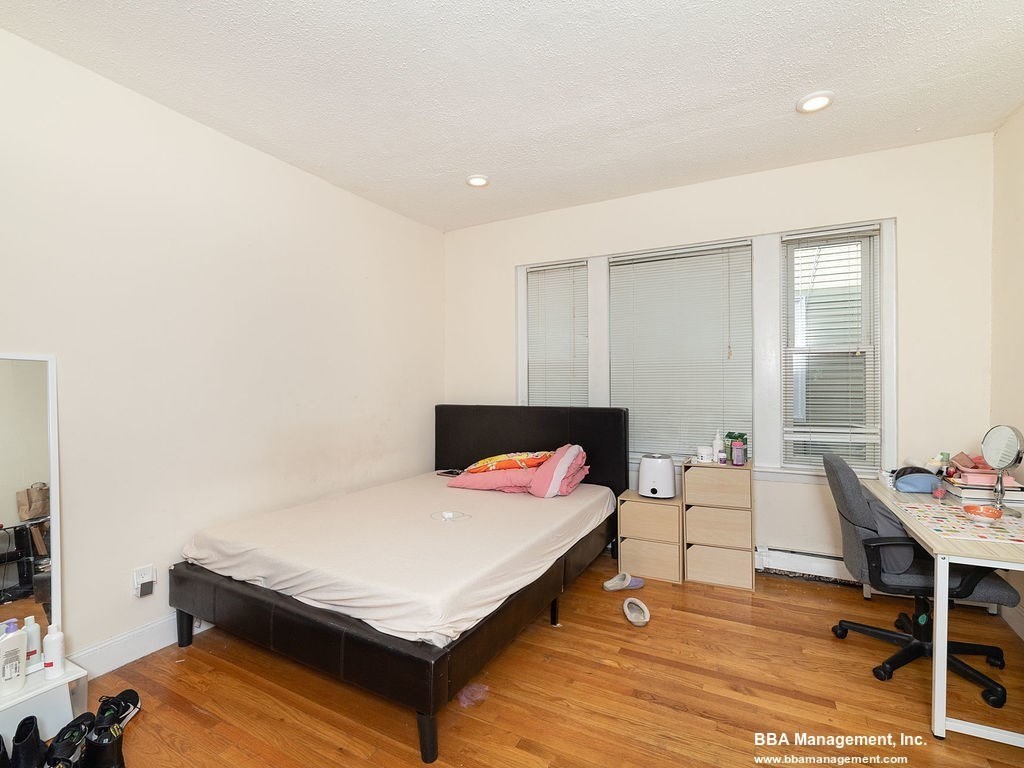 25 Chester Street, Unit 4 Boston, MA 02134 - Photo 8 of 12 a room with furniture and a table