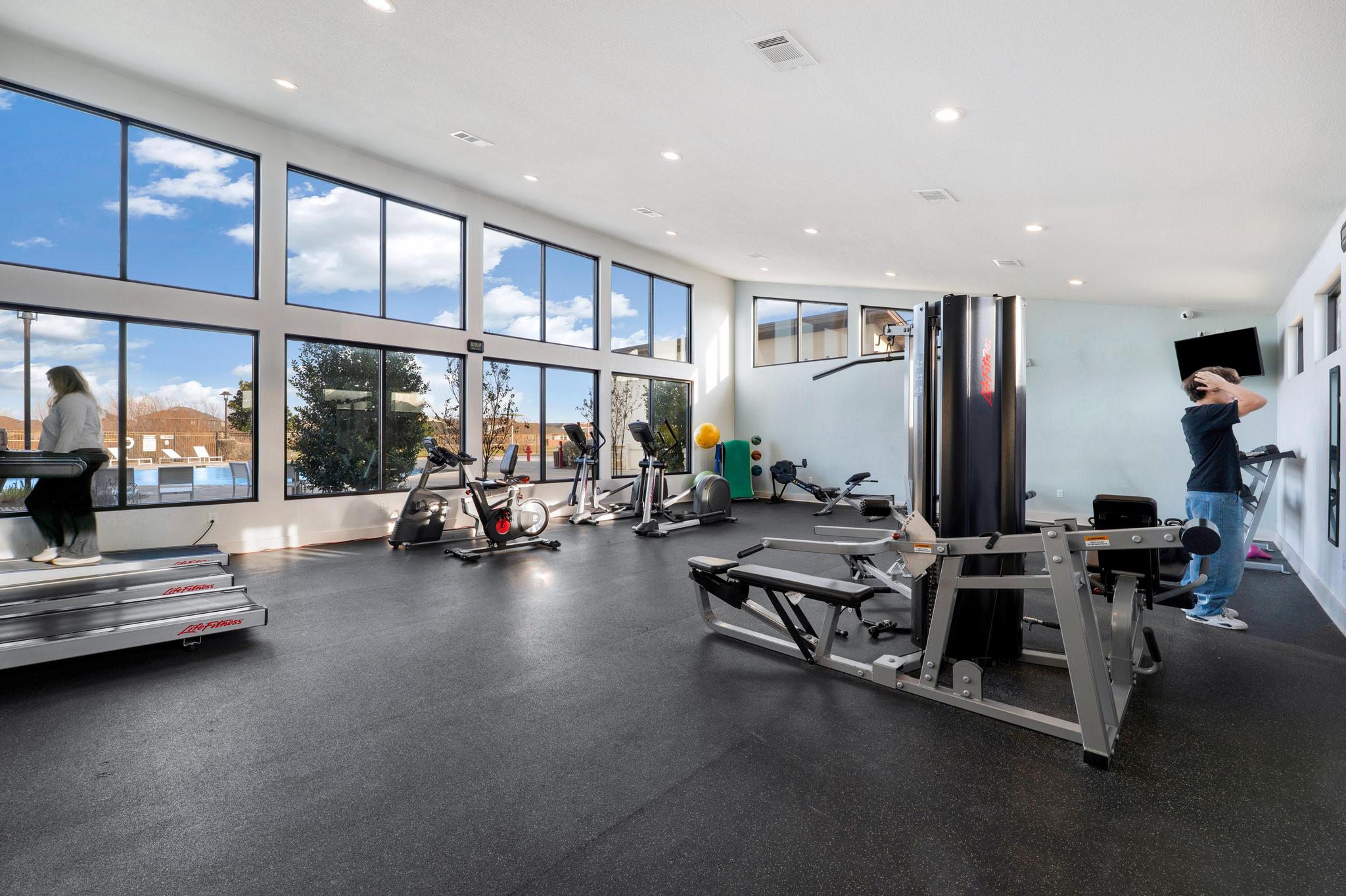 133 Konik Road Georgetown, TX 78626 - Photo 23 of 29 a view of a room with gym equipment and floor to ceiling window