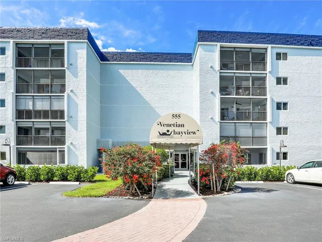 a front view of a building with sitting area