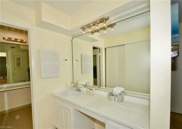 a bathroom with a sink and a mirror