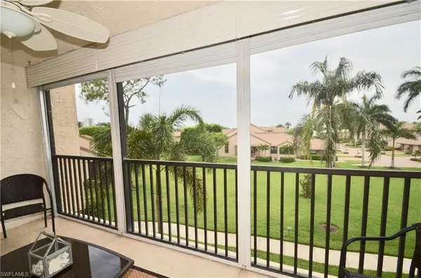 a view of a porch with a floor to ceiling window