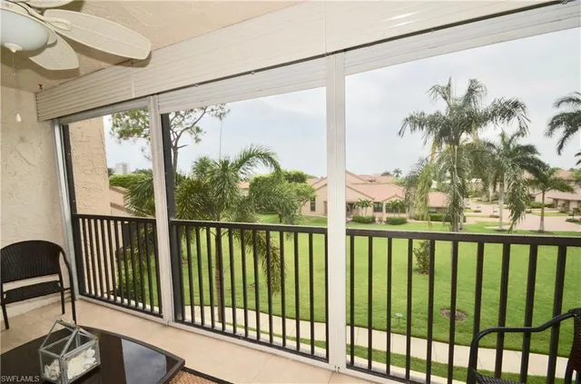 a view of a porch with a floor to ceiling window