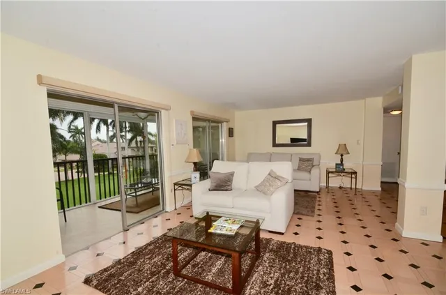 a living room with furniture and a rug
