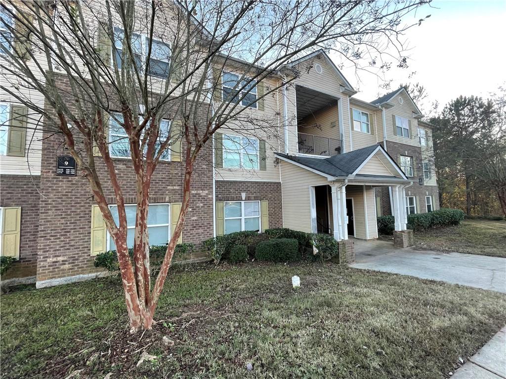 9303 Waldrop Place Decatur, GA 30034 - Photo 1 of 1 a front view of a house with garden