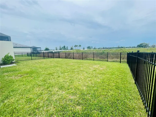 a view of a golf course with a lake view